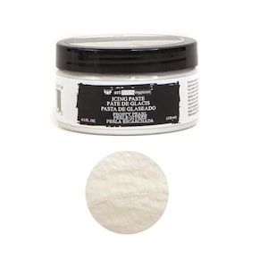 May include: A white frosting paste in a black jar with the label "art extravaganza icing paste pate de glacis pasta de glaseado frosty pearl perle givree perla escarchada 41 fl oz (120ml)"