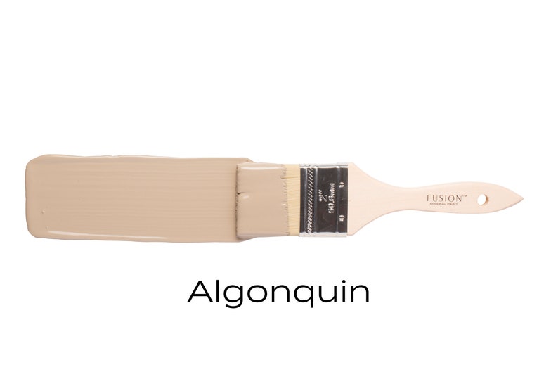May include: A paint swatch of Fusion Mineral Paint in the color Algonquin. The paint is a light beige color and is shown on a paint brush.