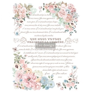 May include: A vintage-style floral design with a quote in French that reads "Que nous voyons vraiment la lumière." The quote is surrounded by pink and blue flowers with green leaves.