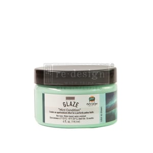 May include: A jar of "Mint Condition" glaze by Re-Design with Prima. The jar is filled with a light green glaze and has a black lid. The label includes text about the product's features and volume: 4 fl. oz. (118.3 ml).