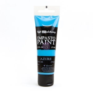 May include: A tube of blue acrylic paint labeled "art alchemy IMPASTO PAINT AZURE 1.5 FL. OZ. (75 ml)"