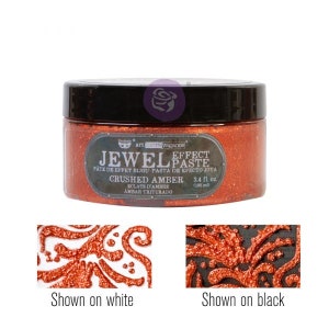 May include: A jar of crushed amber jewel effect paste. The jar is labeled "Jewel Effect Paste" and "Crushed Amber". The paste is shown on both white and black surfaces.