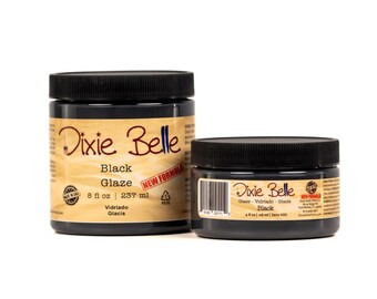 May include: Two black jars of Dixie Belle Black Glaze paint. The larger jar contains 8 fl oz (237 ml) and the smaller jar contains 4 fl oz (118 ml). Both jars have black lids and labels with the Dixie Belle logo.