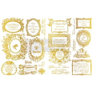 May include: A collection of gold-colored, vintage-style decorative transfers featuring ornate frames, botanical elements, and text. The transfers include various shapes and sizes, perfect for crafting and DIY projects.