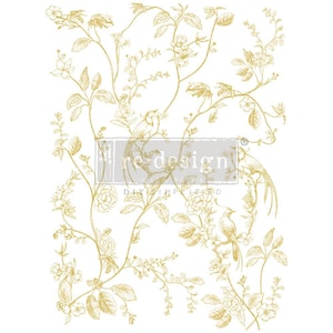 May include: Gold transfer sheet with a floral design featuring birds and leaves. The sheet is labeled "redesigns with prima" and "DIY simplified".