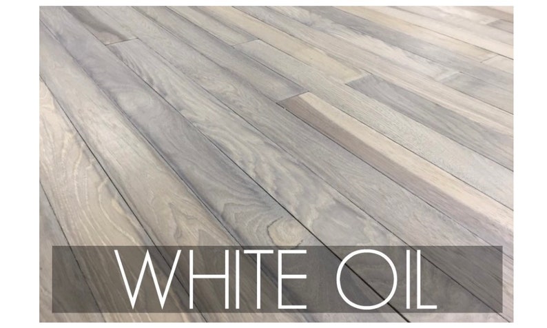 May include: White wood floorboards with a light gray stain. The text "WHITE OIL" is printed in black at the bottom of the image.