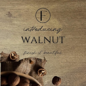 May include: A close-up of a wooden surface with the text "introducing WALNUT finish it beautiful" and a circle with the letter "F" inside. There are walnuts scattered on a burlap surface.