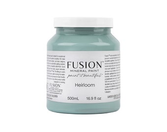 May include: A jar of Fusion Mineral Paint in the color "Heirloom." The jar is a light teal color with a white lid. The label includes the brand name, paint type, and volume: 500ml (16.9 fl oz).