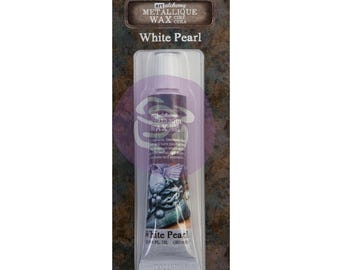 May include: A tube of White Pearl metallic wax by Art Alchemy. The tube is in a clear plastic package with the product name and details printed on the tube. The tube contains 0.68 fl. oz. (20 ml) of wax. The packaging also includes the text "Do not store over 66°F (38°C)."