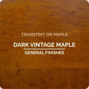 May include: A close-up of a dark brown wood grain surface. The text "TRANSTINT ON MAPLE" is at the top, with "DARK VINTAGE MAPLE" below, and "GENERAL FINISHES" at the bottom, all in white.