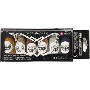 May include: A set of six bottles of metallic micro beads in various colors, including gold, bronze, and silver. Each bottle has a white label with a butterfly design and the brand name "Finnabair". The packaging reads "art ingredients".