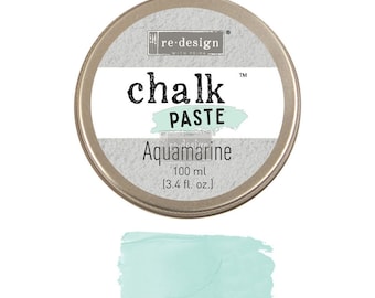 May include: A round tin of re-design with prima chalk paste in the color aquamarine. The tin is silver with a white label that says "re-design with prima chalk paste" and "Aquamarine". The label also says "100 ml (3.4 fl. oz.)".