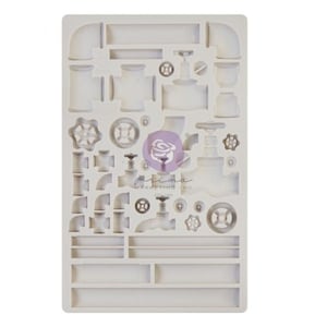 May include: A white silicone mold with a design of various plumbing pipes, valves, and gears. The mold is designed for making decorative sugar paste or fondant creations.