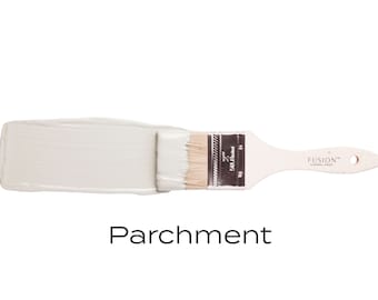 May include: A close-up of a paint brush with a light gray paint sample. The paint is labeled "Parchment" and is from the Fusion Mineral Paint brand.