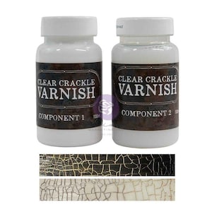 May include: Two white plastic bottles of clear crackle varnish, labeled Component 1 and Component 2, each containing 100ml. Below the bottles are two rectangular samples showing a black and a white surface with a fine, cracked texture finish.