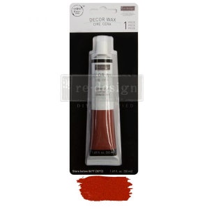 May include: A tube of red decor wax labeled "Decor Wax" and "Cire Cera". The tube is 1.69 fl oz (50 ml) and is packaged on a white card with the text "Re-Design".