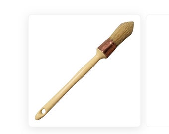 May include: A wooden-handled paint brush with a white bristle head and a copper ferrule.