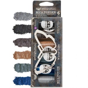 May include: A set of six mica powder jars in a box with a butterfly design. The jars are labeled "Finnabair" and the box says "Winter Tales" and "art(ingredients)". The mica powders are in shades of blue, gray, and brown.