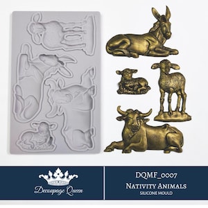 May include: Silicone mold for making nativity animal figurines. The mold is gray and shows the outlines of a donkey, cow, sheep, and lamb. The mold is labeled "DQMF_0007 NATIVITY ANIMALS SILICONE MOULD".