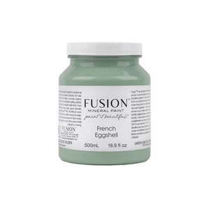 May include: A 500mL bottle of Fusion Mineral Paint in the color French Eggshell. The bottle is green and has a white label with the Fusion logo and the paint color name.