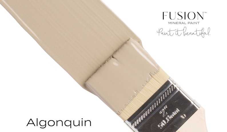 May include: A close-up of a paint brush with a light beige paint sample. The paint is labeled "Algonquin" and the brand is "Fusion Mineral Paint, Paint it beautiful."