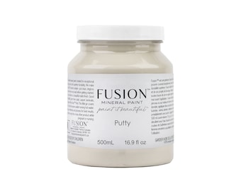 May include: A 16.9 fluid ounce bottle of Fusion Mineral Paint in the color Putty. The bottle is white with a black label and the Fusion logo. The paint is a light beige color.
