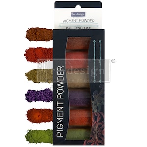 May include: A set of six pigment powders in a clear plastic container with a black label that reads "re-design with Prima" and "Pigment Powder". The powders are labeled "Fall Foliage" and are in shades of green, brown, orange, and purple.