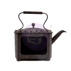 May include: A rustic, dark brown metal teapot with a square body and a handle. The teapot has a spout and a lid with a knob. The teapot has a distressed look with a worn finish.