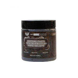 May include: A gray jar of texture paste with the text "Texture Paste, Pate de Structure, Pasta Relieve" and "Graphite, Grafite, Grafito" on the label. The jar is 8.5 fl oz (250 ml).