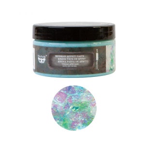 May include: A jar of iridescent glitter paste labeled "Mermaid Effect Paste" in a blue and brown color scheme. The jar is 3.4 fl oz (100 ml).