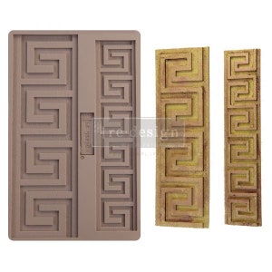 May include: A brown silicone mold with a Greek key pattern. The mold is designed to create three separate decorative pieces. The mold is shown next to three finished pieces, which are made of a gold-colored material.