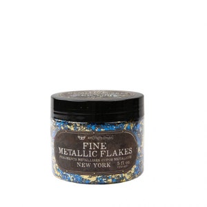 May include: A jar of fine metallic flakes in gold and blue colors. The jar is labeled "Fine Metallic Flakes" with the text "Fragments Metallise Copas Metalicus New York 5 fl oz (150 ml)"