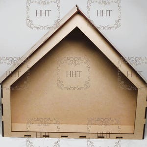 May include: A wooden house-shaped shelf with a triangular roof and a rectangular opening in the front. The shelf is made of unfinished wood and has a natural brown color.
