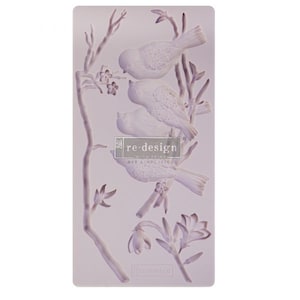 May include: A silicone mold for crafting with a design of three birds perched on branches with flowers. The mold is purple and features the text "re-design with prima DIY simplified".