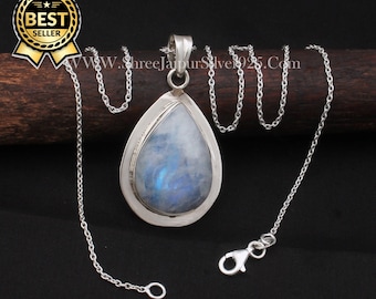 May include: A silver chain necklace with a teardrop-shaped pendant featuring a blue and white moonstone. The pendant has a silver border and a delicate design. The chain is a simple, silver chain.