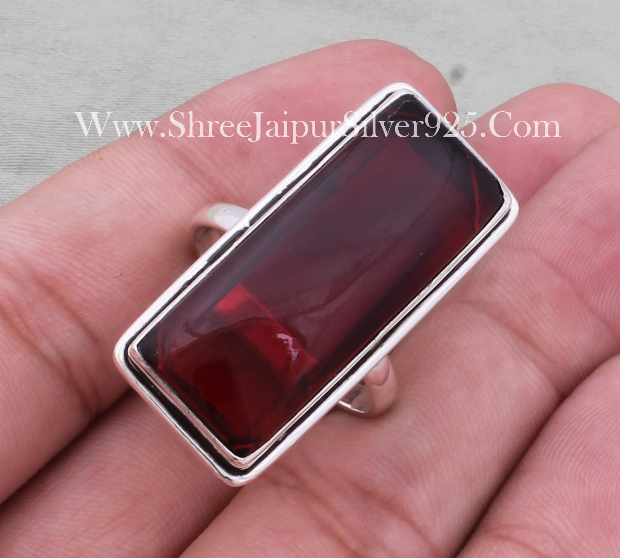 Red stone 2024 ring price