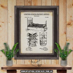 May include: Framed vintage patent print of a Strait Jacket from the United States Patent Office, dated May 1, 1900. The black and white illustration shows a bed and the jacket design. The print is displayed in a dark brown frame.