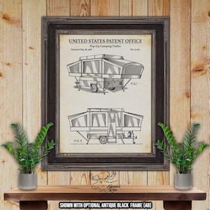 May include: Black and white line drawing of a pop-up camping trailer patent. The patent is titled "United States Patent Office Pop-Up Camping Trailer" and was patented on May 28, 1968. The drawing shows two different views of the trailer, one with the top up and one with the top down.