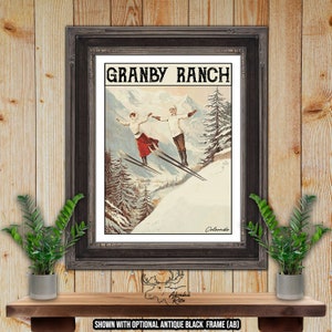 May include: Vintage travel poster for Granby Ranch in Colorado, featuring a couple skiing down a snowy mountain slope. The poster has a retro design with a white background and black text.