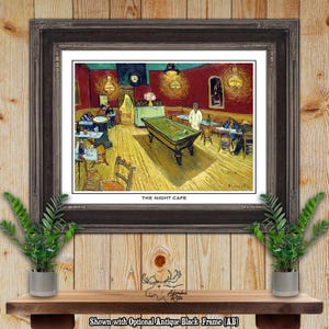 May include: Framed print of Van Gogh's "The Night Cafe" featuring a vibrant interior scene with a pool table, patrons, and warm lighting. The artwork is set in a dark antique black frame, enhancing the classic aesthetic.
