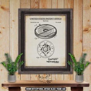 May include: A vintage patent drawing for a reel case. The drawing shows a side view of the reel case with a label that reads "Reel Case". The patent number is 3,306,968. The patent was filed on May 7, 1967.