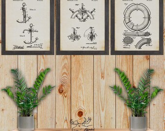 May include: Three vintage nautical patent prints in black and white, framed in rustic black wood. The prints depict an anchor, a steering wheel, and a life preserver.