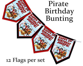 May include: Pirate-themed birthday bunting with four pennant flags. Each flag features a cartoon pirate with a treasure chest and the text "HAPPY 3RD BIRTHDAY JOSEPH!". The bunting is red, black, and white.