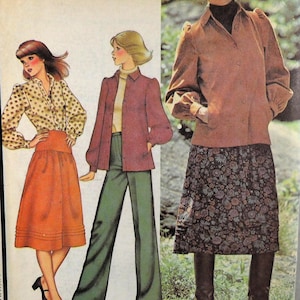 May include: Vintage sewing pattern featuring three women's outfits. The outfits include a skirt, pants, and a button-down shirt. The color palette includes shades of orange, green, and brown. The text "Pants not included" is visible.