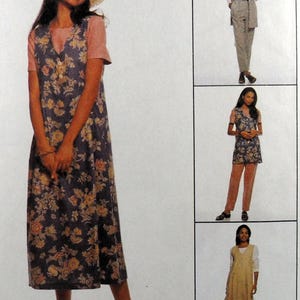 May include: A woman wearing a straw hat and a floral print dress. The dress is dark blue with yellow and orange flowers. The image also shows other outfits, including a vest and pants, and a long beige dress.