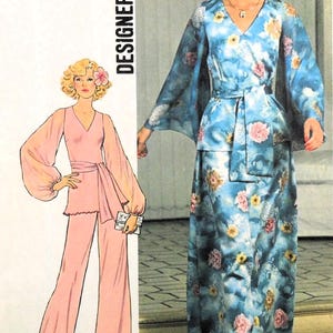 May include: Vintage fashion illustration featuring two women in 1970s-style outfits. One model wears a light pink pantsuit with wide-leg pants and a matching top. The other model is in a blue floral print dress with a matching belt and long sleeves.