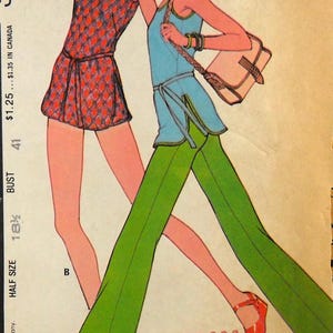 May include: Vintage fashion illustration featuring two figures in 1970s attire. One wears a red and orange diamond-patterned mini-dress, the other a blue top and green pants. The image includes text: "Make it EASY" and "5174".