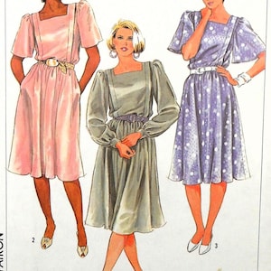 May include: Illustration of three dresses with square necklines and belted waists. The dresses are in pink, grey-green, and lavender with white polka dots. The dresses have short or long sleeves and are knee-length. The models are wearing matching shoes.