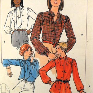 May include: A sewing pattern for a blouse with a bow tie. The pattern includes three different views of the blouse, one in white, one in red, and one in blue. The pattern is for sizes 6-16.