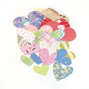25 paper heart cutouts, set of 25 different heart shapes, heart die cuts, different colors, sizes and designs. Heart shapes.
